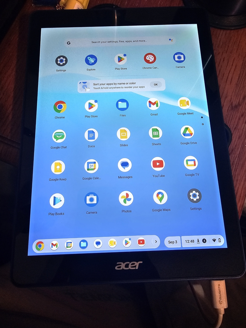 Acer Black Tablet with Bright Blue Home Screen